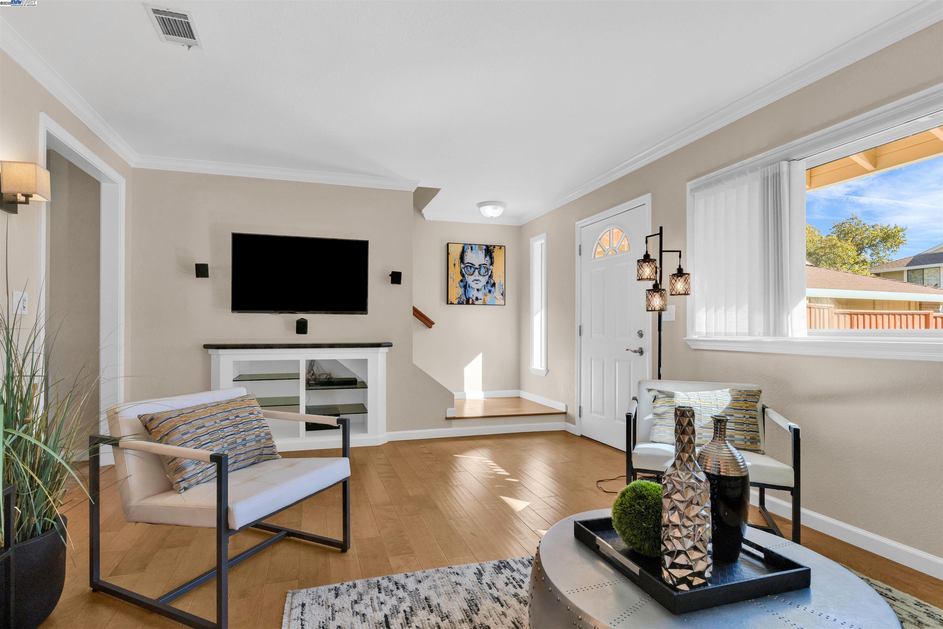 7602 Arbor Creek Circle Dublin, CA 94568 - Photo 2 of 47 a living room with furniture and a flat screen tv