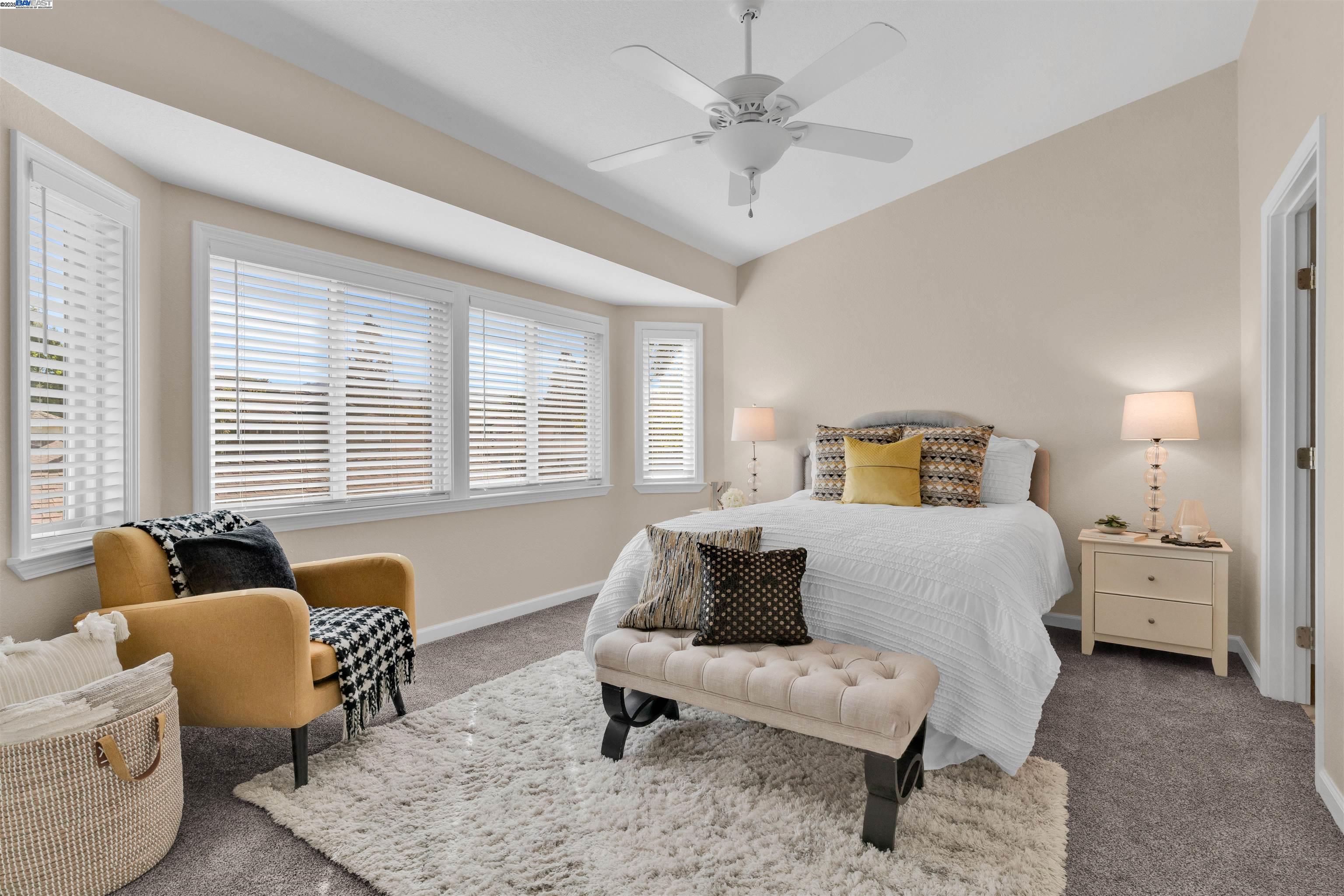 7602 Arbor Creek Circle Dublin, CA 94568 - Photo 24 of 47 a bedroom with a bed and wooden floor