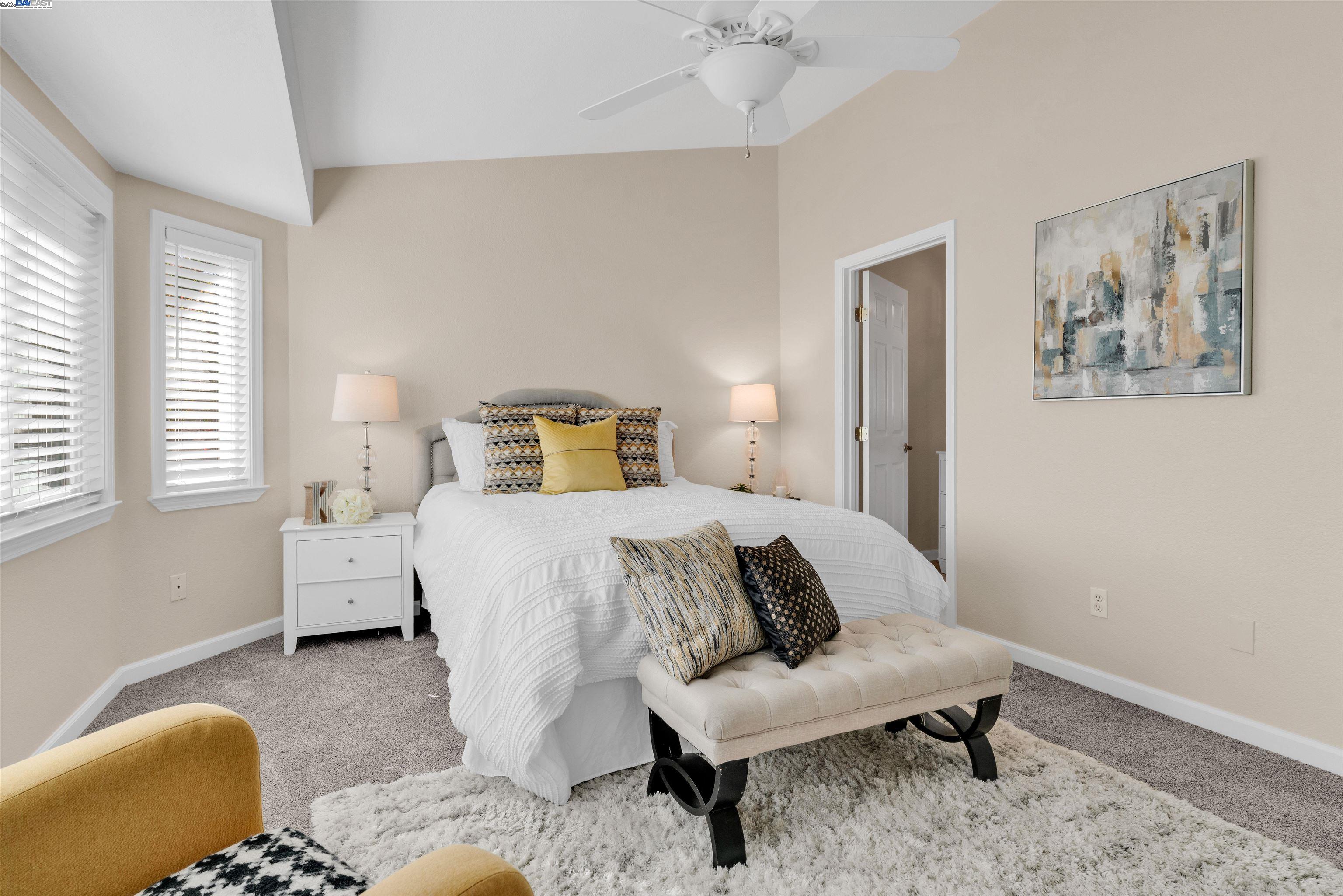 7602 Arbor Creek Circle Dublin, CA 94568 - Photo 25 of 47 a bedroom with a bed and wooden floor