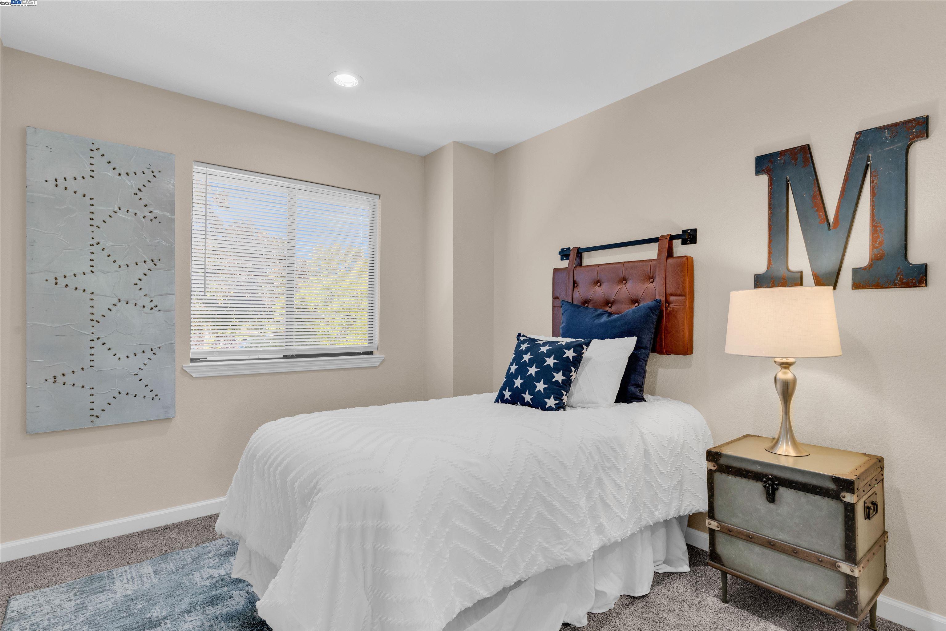 7602 Arbor Creek Circle Dublin, CA 94568 - Photo 29 of 47 a bedroom with a bed and a night stand