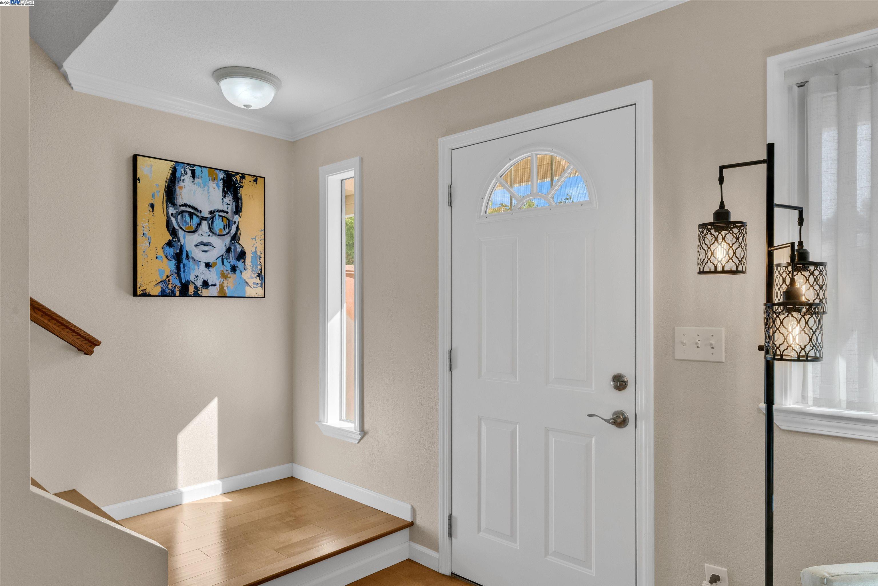 7602 Arbor Creek Circle Dublin, CA 94568 - Photo 5 of 47 a view of an entryway with wooden floor