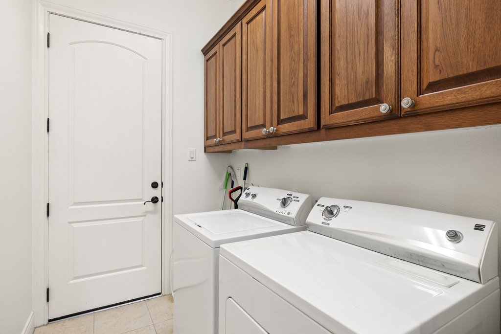 108-2 Rivalto Circle, Unit 2 Lakeway, TX 78734 - Photo 17 of 21 a utility room with dryer and washer