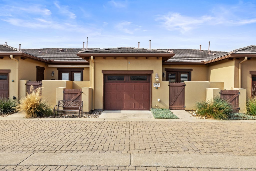 108-2 Rivalto Circle, Unit 2 Lakeway, TX 78734 - Photo 19 of 21 a front view of a house with a yard