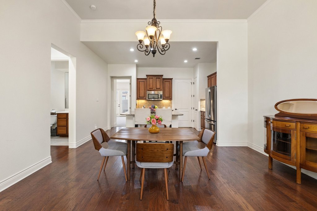 108-2 Rivalto Circle, Unit 2 Lakeway, TX 78734 - Photo 3 of 21 a view of a dining room with furniture and wooden floor