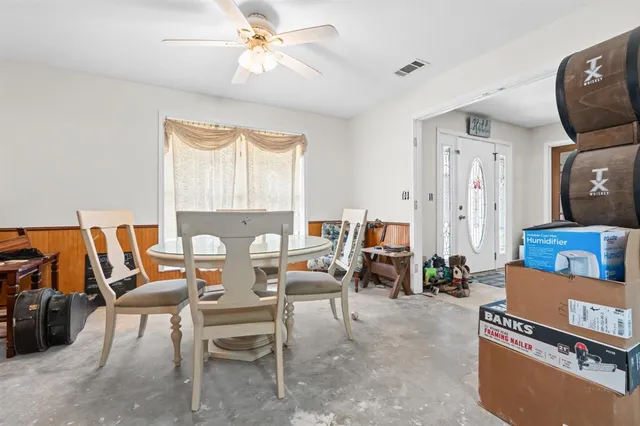 a view of a livingroom with furniture and a window