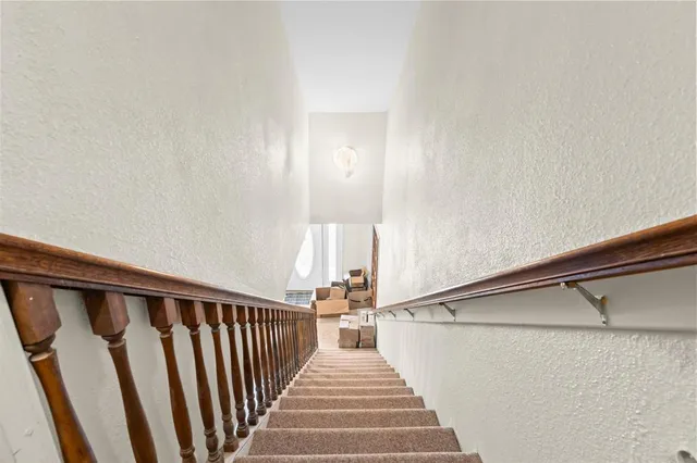 a view of a hallway with staircase