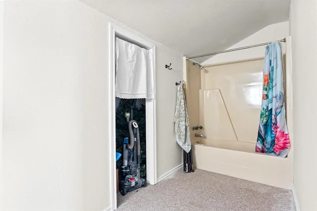 a view of hallway with furniture and a window