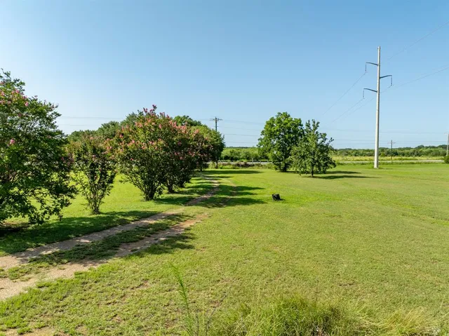 a view of a golf course with a lake view