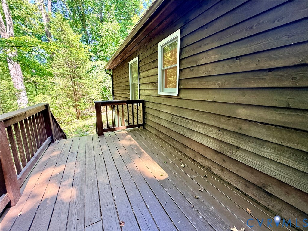 2590 Davis Mill Road Goochland, VA 23063 - Photo 24 of 33 a view of a wooden deck with a yard