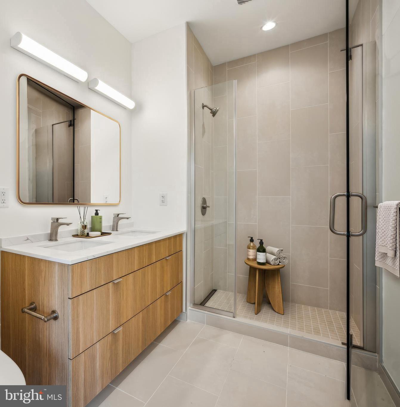 5300 Wisconsin Avenue Northwest, Unit TH3/VARIES Washington, DC 20015 - Photo 15 of 29 a bathroom with a sink and a mirror