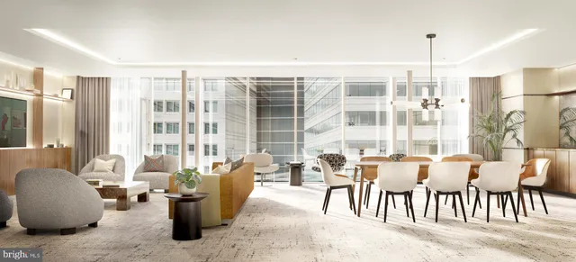 a living room with lots of furniture and a large window