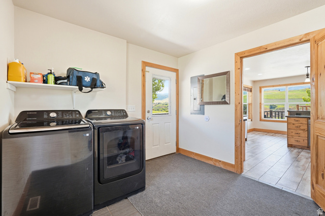 306 Spring Road Preston, ID 83263 - Photo 26 of 55 Dedicated laundry area with a white shelving unit, light-colored walls, and wood-trim doorways