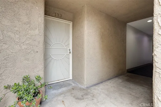 a kitchen with stainless steel appliances granite countertop a stove and a wooden floors
