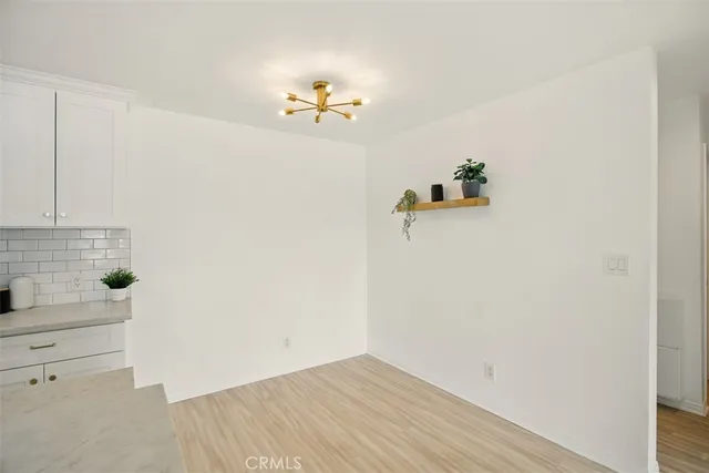 a kitchen with stainless steel appliances a stove microwave and sink