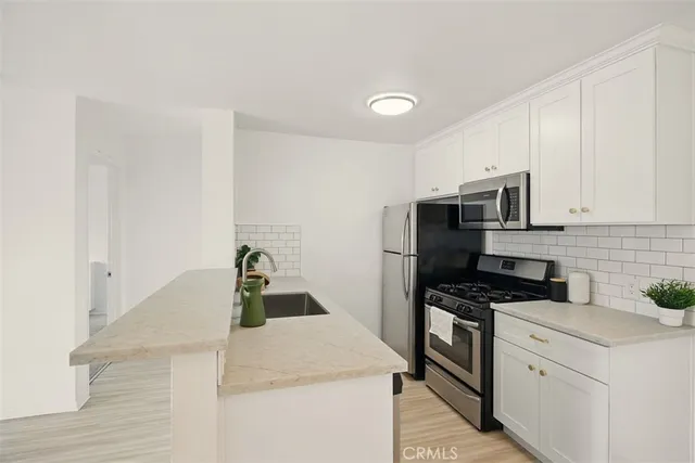 a kitchen with a sink and a window