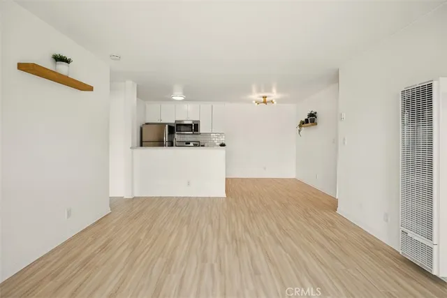 a view of kitchen with wooden floor