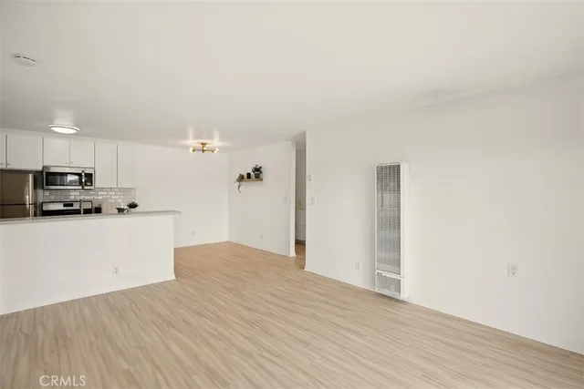 a view of a balcony with wooden fence