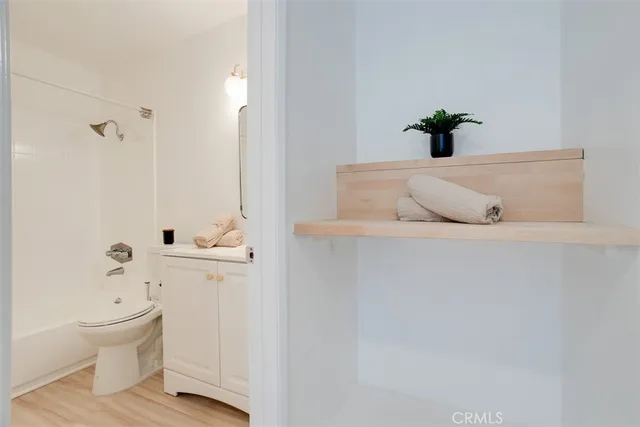 a view of washer and dryer with kitchen in the background