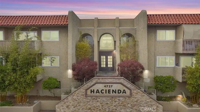 a view of a patio with table and chairs and potted plants
