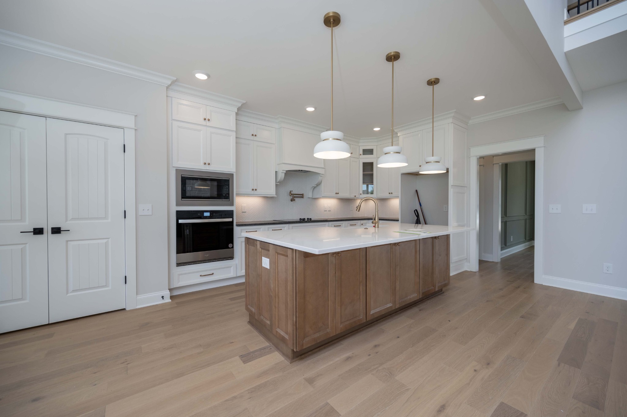 0 Linwood Road Watertown, TN 37184 - Photo 14 of 48 a large kitchen with kitchen island a island wooden floor stainless steel appliances and a counter space