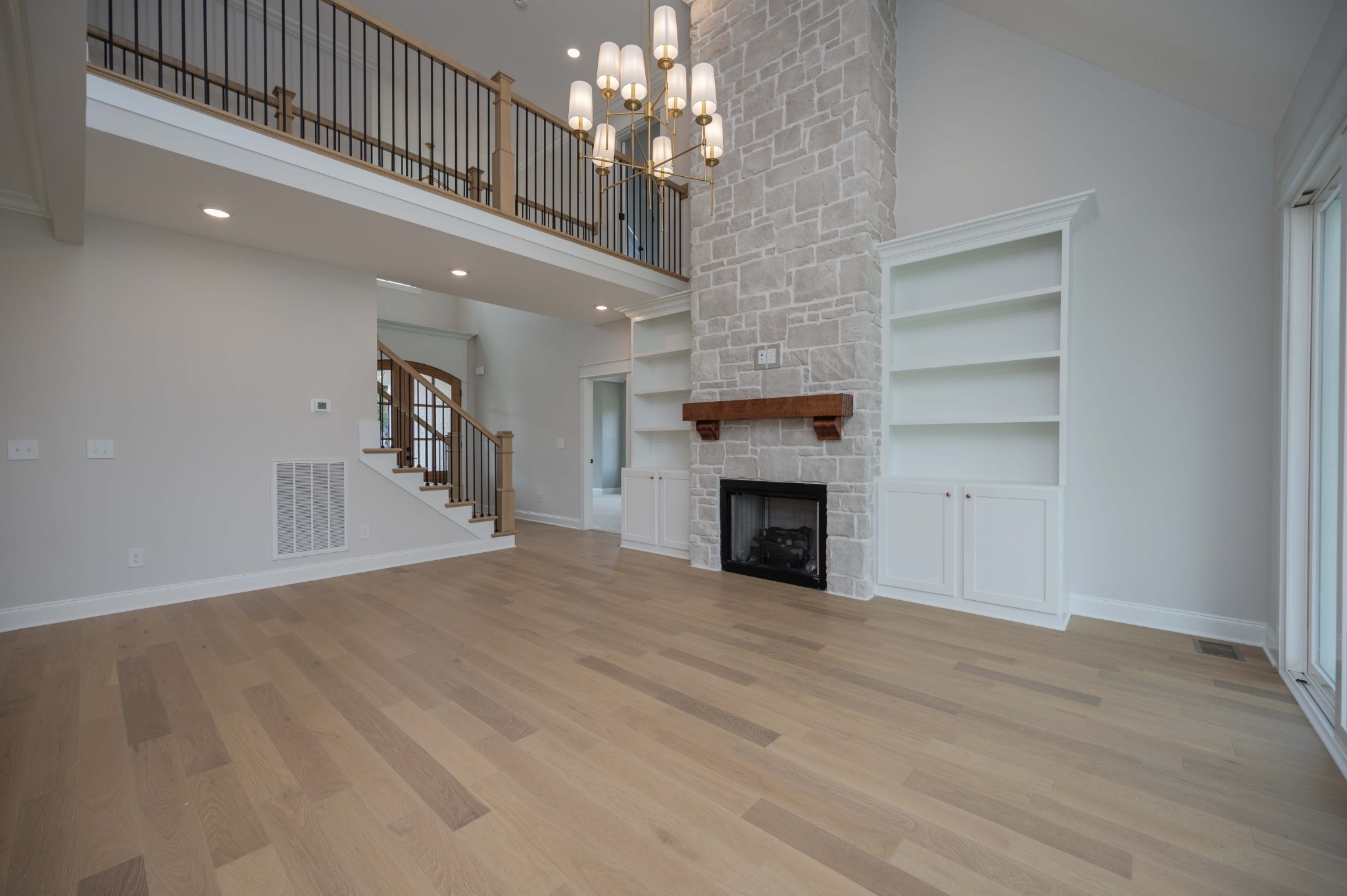 0 Linwood Road Watertown, TN 37184 - Photo 8 of 48 a view of an empty room with a fireplace and a chandelier
