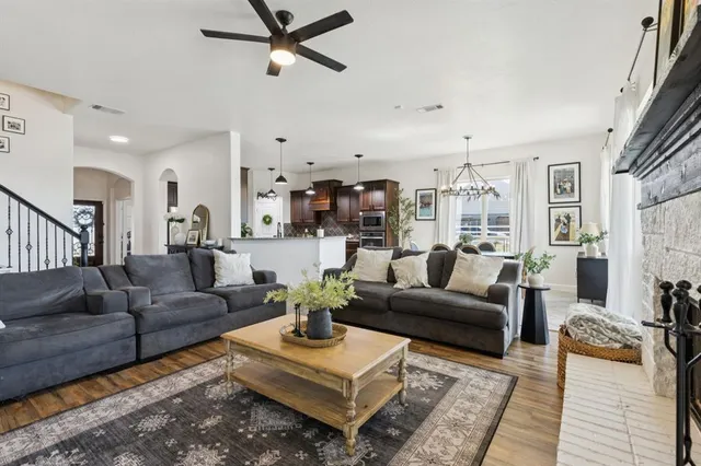 a living room with furniture or couch and a wooden floor