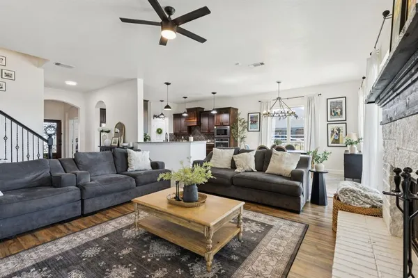 a living room with furniture or couch and a wooden floor