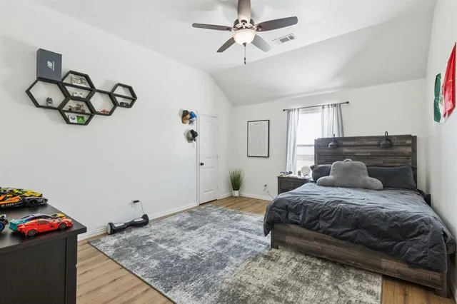 a bedroom with a bed and cabinets