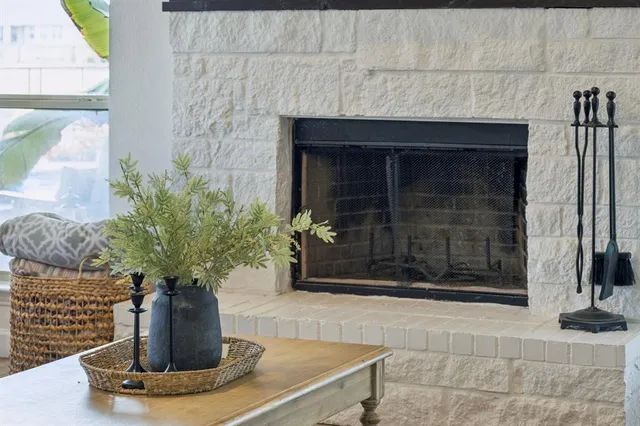 a vase of flowers sitting on a dining table