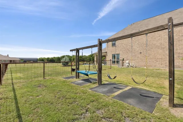a view of swimming pool with a patio