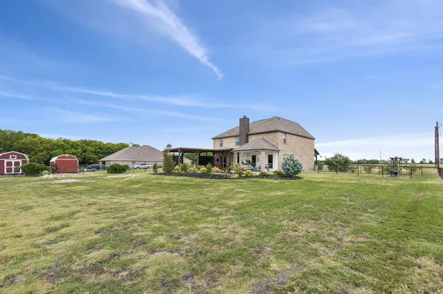 a view of a big yard with a house