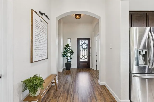 a view of entryway with wooden floor