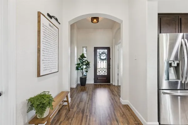 a view of entryway with wooden floor