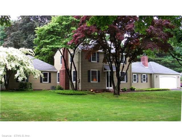 719 Ridge Road Orange, CT 06477 - Photo 1 of 1 a black and white house with a big yard and large trees