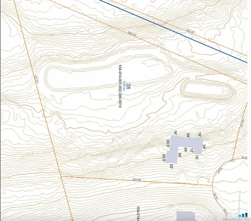 a view of a field with plants and trees