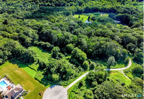 a view of a street with a park