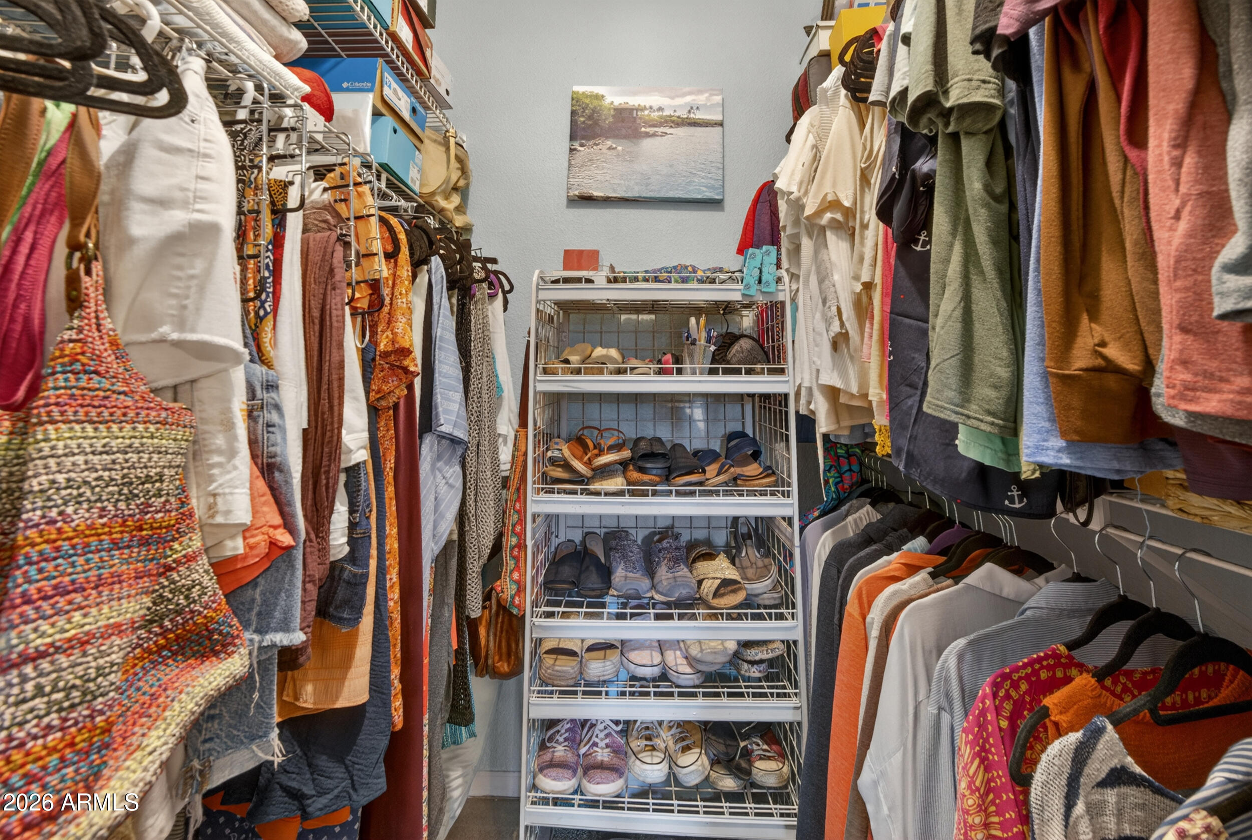 1222 West Baseline Road, Unit 153 Tempe, AZ 85283 - Photo 12 of 33 a view of walk in closet with clothes and shoes