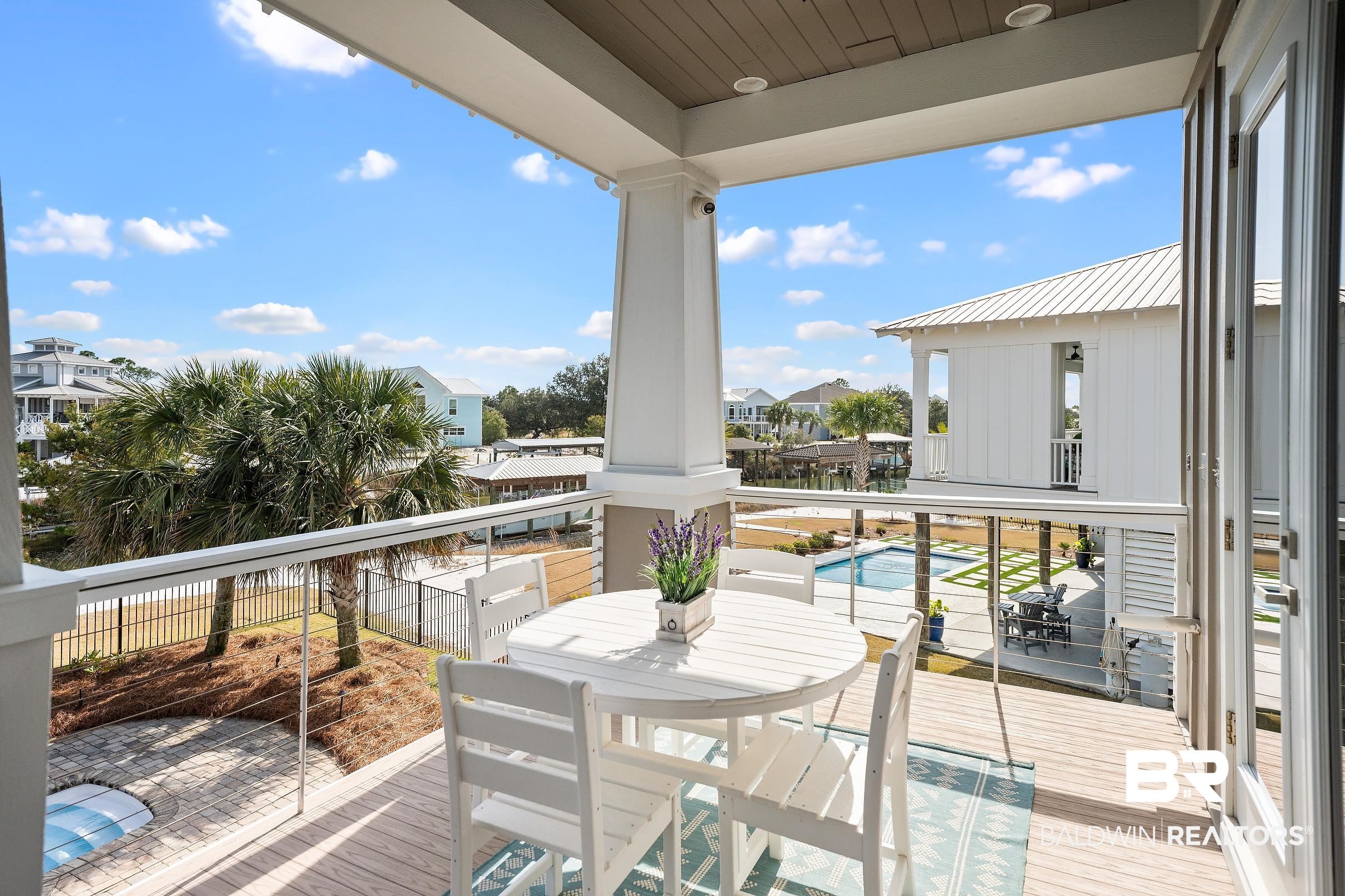 33186 Marlin Key Drive Orange Beach, AL 36561 - Photo 29 of 87 Balcony with outdoor dining space and view of pool area