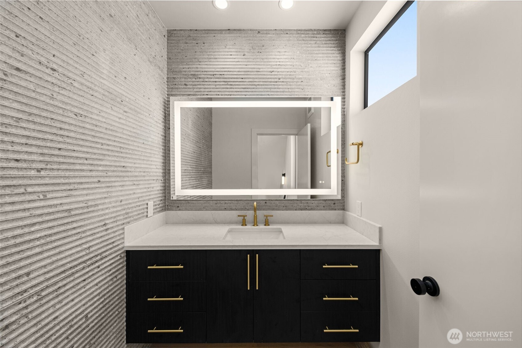 6833 36th Avenue Northeast Seattle, WA 98115 - Photo 11 of 40 a bathroom with a sink and a mirror