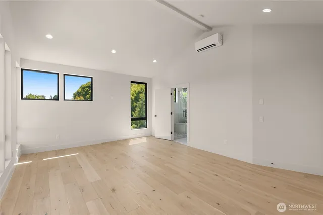 a bathroom with a double vanity sink a toilet and a mirror