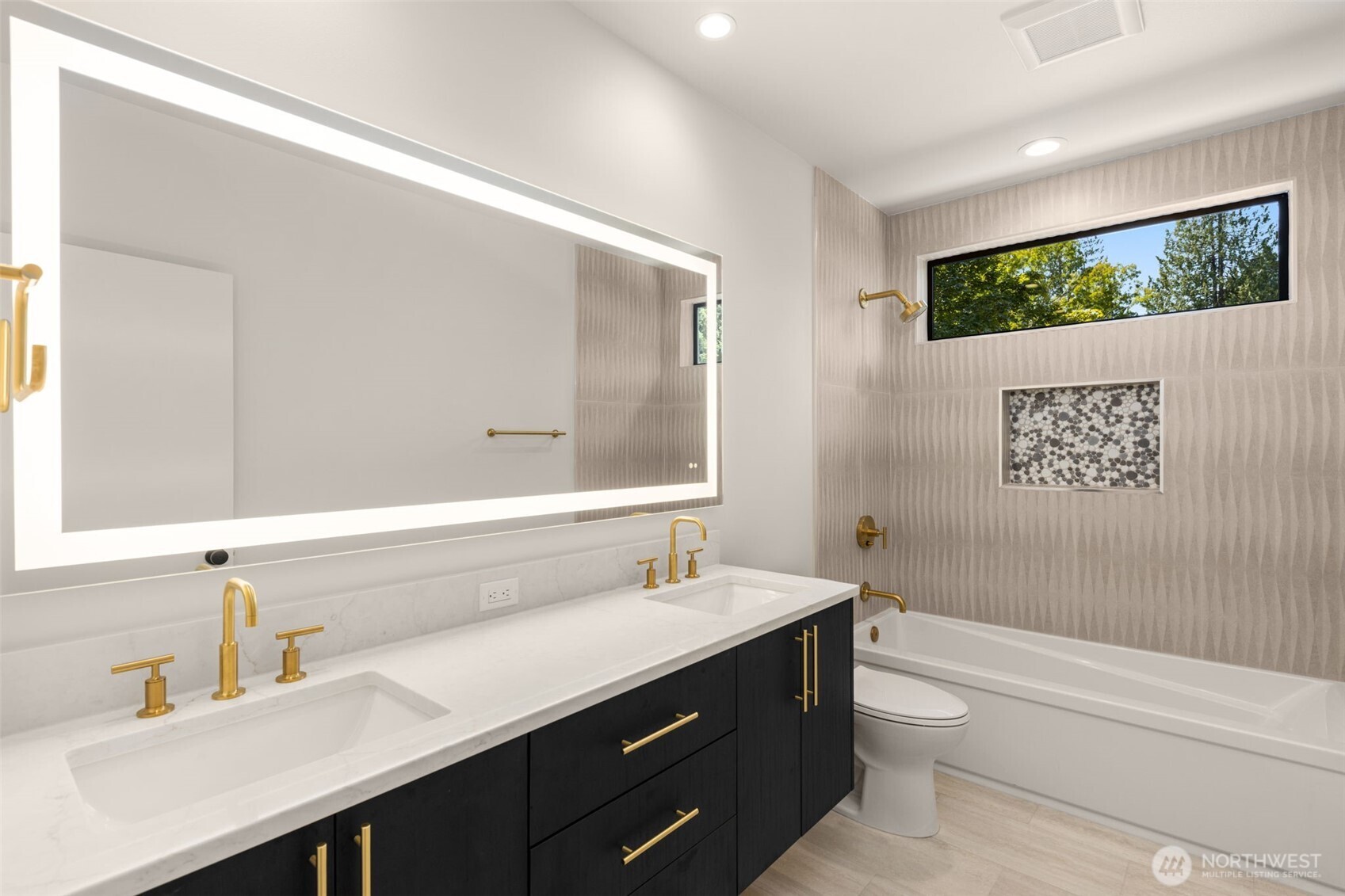 6833 36th Avenue Northeast Seattle, WA 98115 - Photo 13 of 40 a bathroom with a double vanity sink a toilet and a mirror