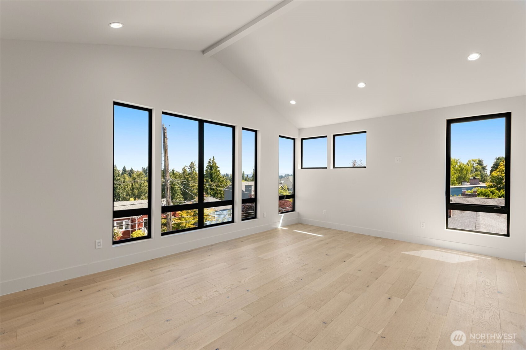 6833 36th Avenue Northeast Seattle, WA 98115 - Photo 15 of 40 an empty room with floor to ceiling window and an outdoor view