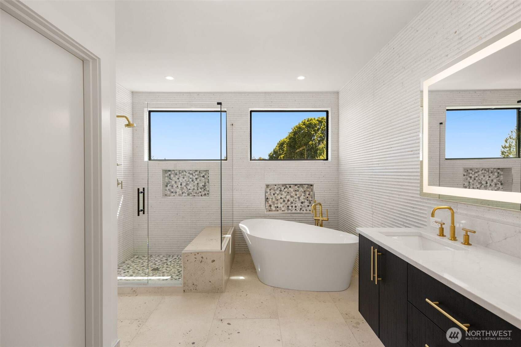 6833 36th Avenue Northeast Seattle, WA 98115 - Photo 17 of 40 a spacious bathroom with a tub sink and mirror