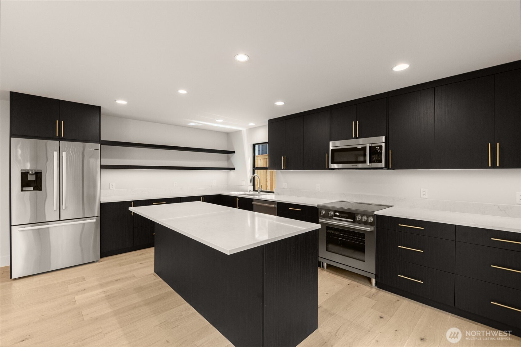 6833 36th Avenue Northeast Seattle, WA 98115 - Photo 23 of 40 a kitchen with stainless steel appliances a refrigerator and a sink