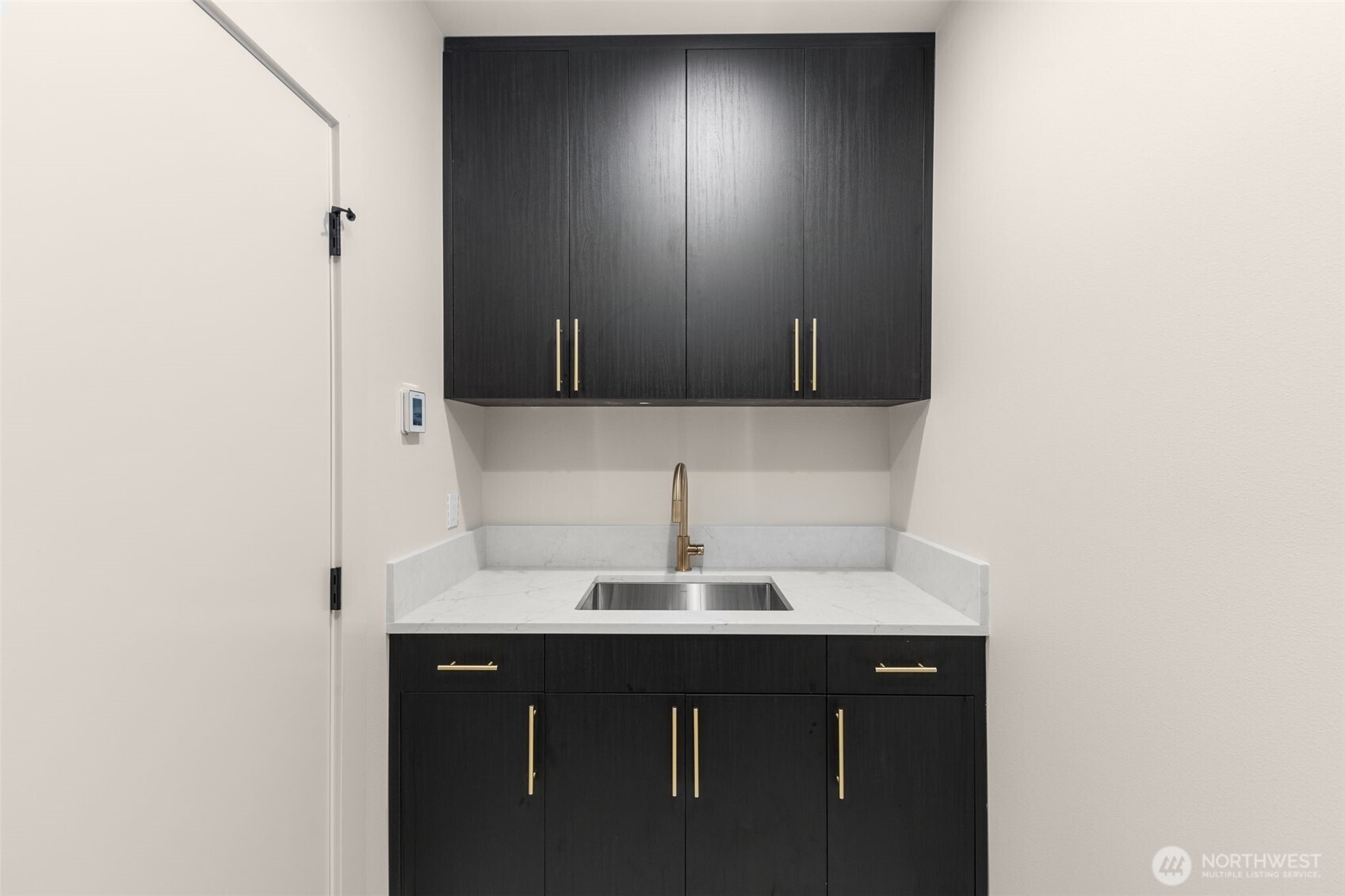 6833 36th Avenue Northeast Seattle, WA 98115 - Photo 28 of 40 a bathroom with a sink and a mirror