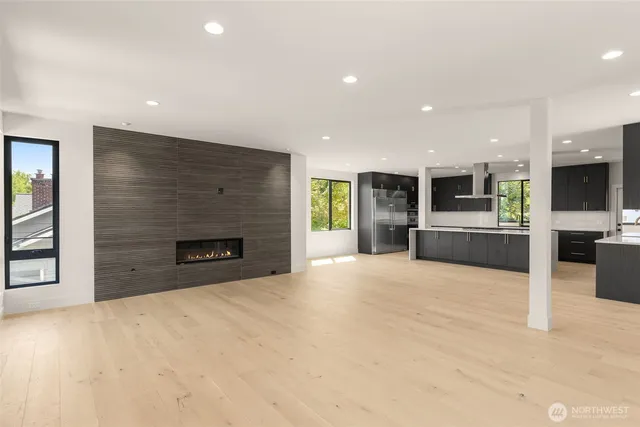 a view of kitchen with furniture and a fireplace