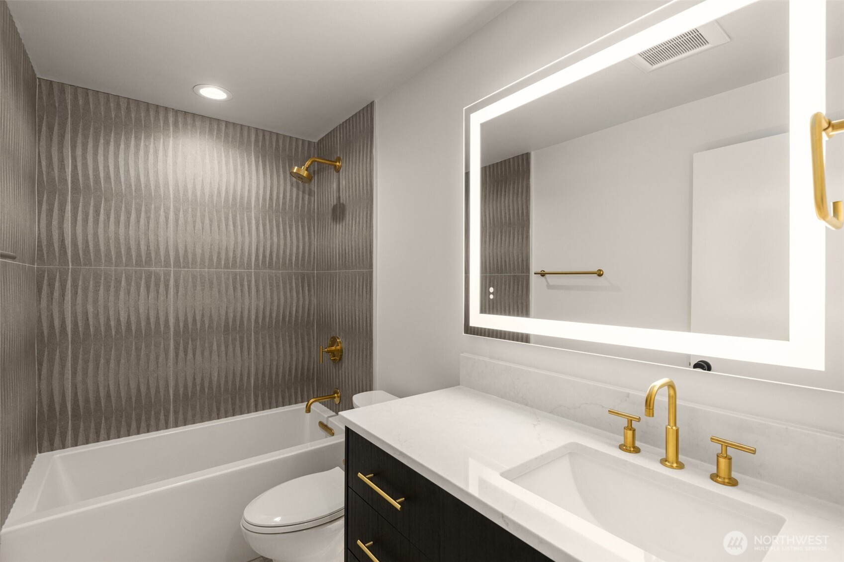 6833 36th Avenue Northeast Seattle, WA 98115 - Photo 31 of 40 a bathroom with a sink a toilet a mirror a bathtub and shower