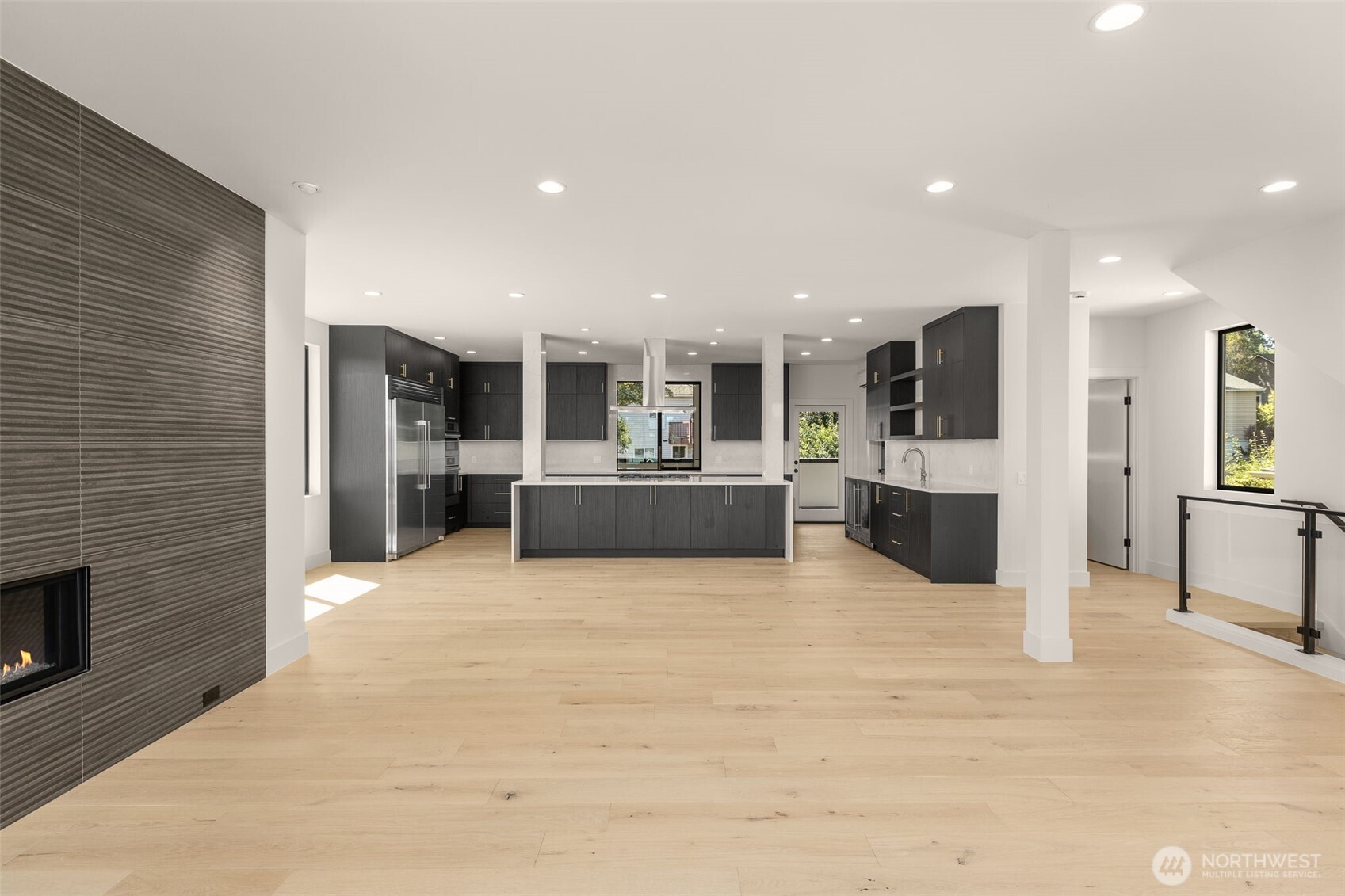 6833 36th Avenue Northeast Seattle, WA 98115 - Photo 4 of 40 a large kitchen with stainless steel appliances kitchen island granite countertop a large kitchen counter top and oven
