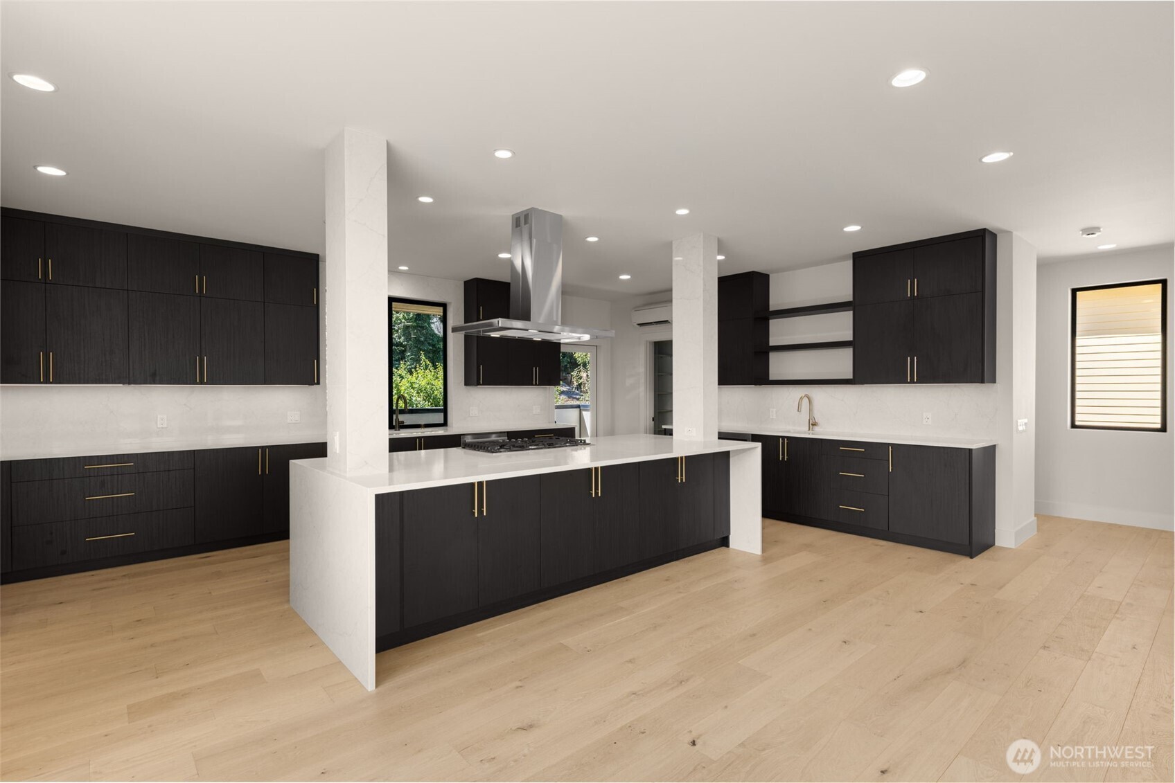 6833 36th Avenue Northeast Seattle, WA 98115 - Photo 7 of 40 a large kitchen with stainless steel appliances and a large counter top