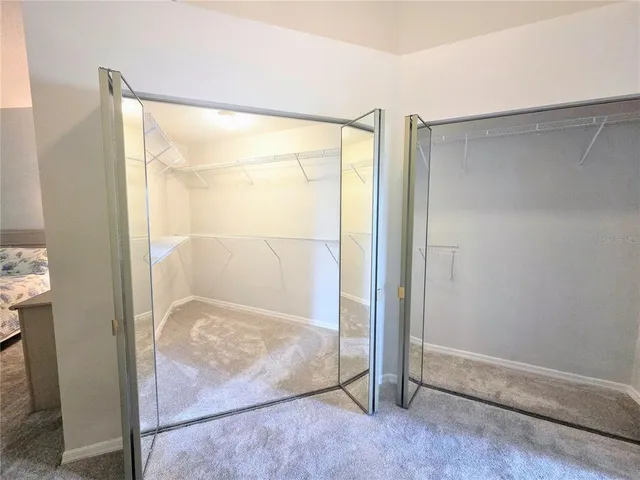 an empty room with a glass door and glass door